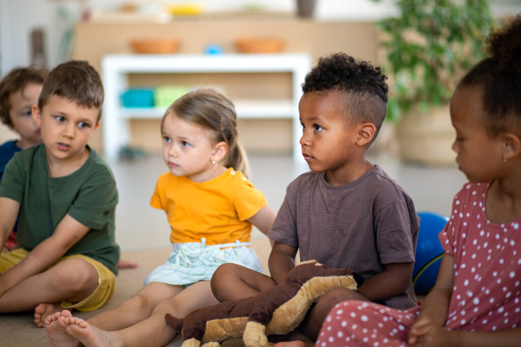 a group of children sitting on the floor