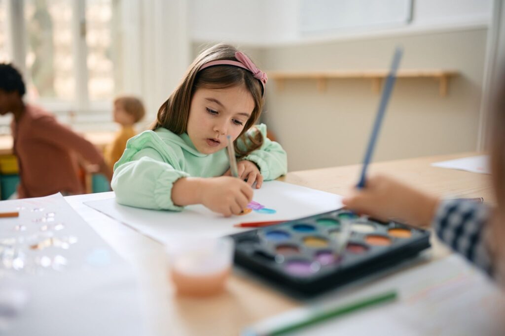 a child drawing on a paper